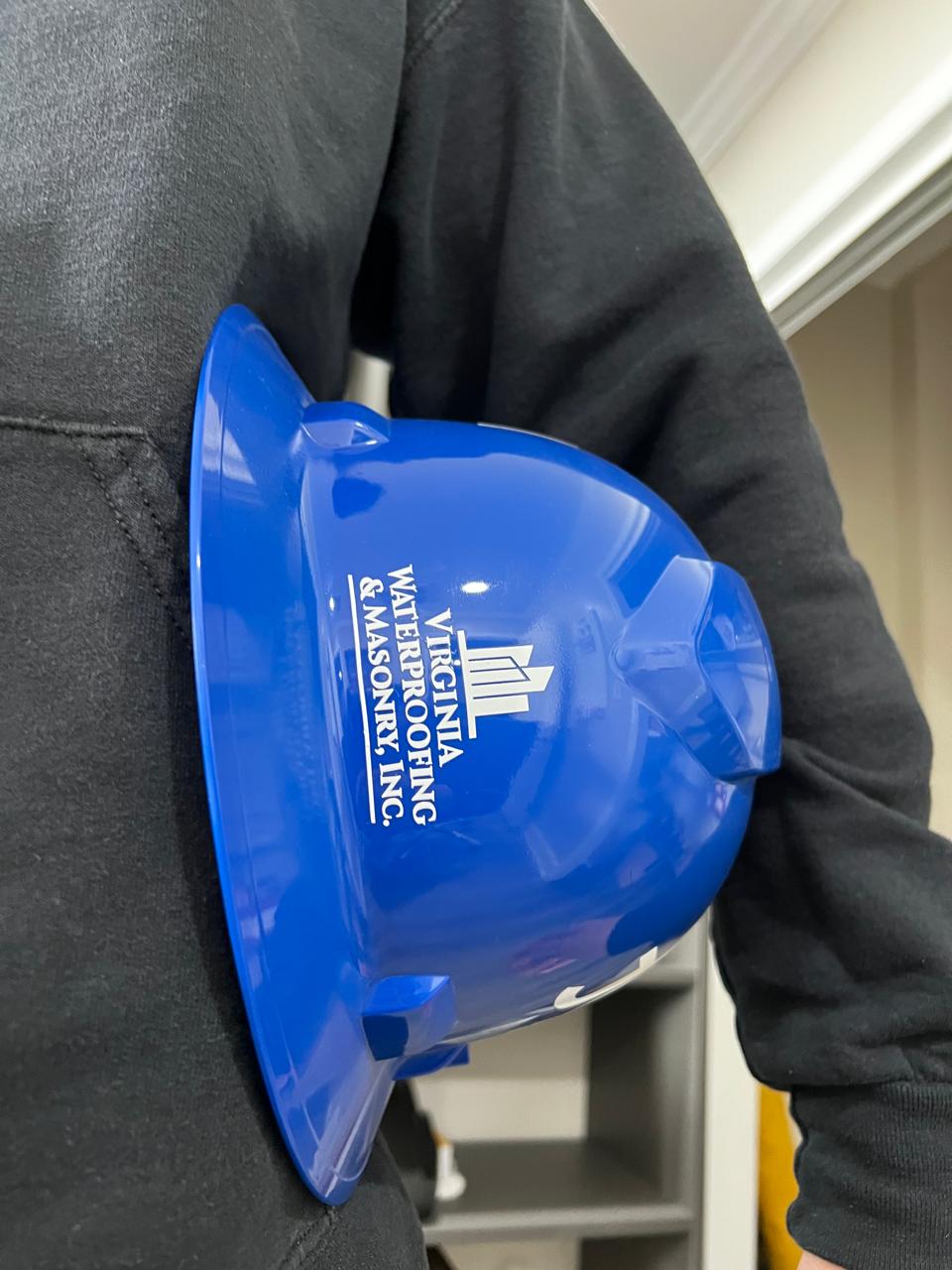 Branded VWMI hard hat, symbol of the company's safety-first standard